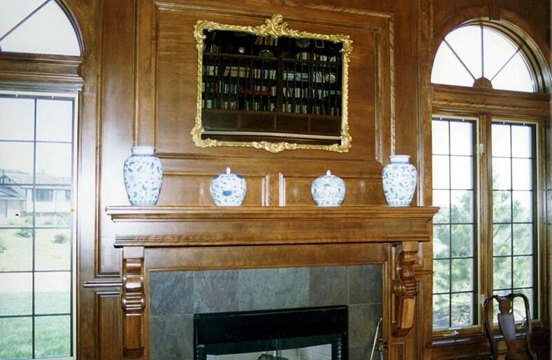 Fireplace surround and mantle with carved corbels
