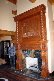Charles Hensley with carved detailed fireplace mantle