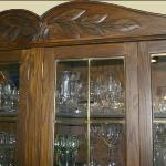 Detail of carving on reproduction white oak china hutch