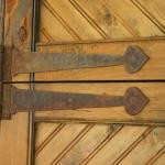 Rusted metal hardware on distressed door