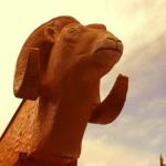 Big horn sheep carved into log end