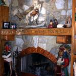 Carved fireplace mantle and rustic built in bookcases