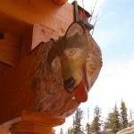 Wolf carved into beam end