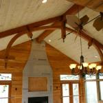 Timber frame truss installed to look as if it supports the roof