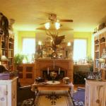 Home library with carved fireplace mantle and carved rose knotty pine cabinets