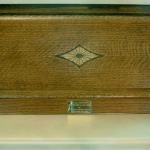 Close up of inlay in oak display case