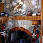 Built in cabinets on either side of carved fireplace mantle.