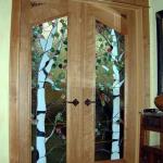 Cherry double door with stained and leaded glass.