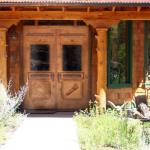 Reproduction antique double doors with 3 panel transom. Custom carvings.