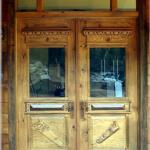Close up of custom reproduction carved and distressed double doors.