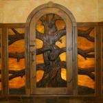 This is one of our latest creations.  The colored glass is sandwiched between carved wood.  This is the view from the inside.