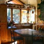 Overall kitchen view with slate countertop and custom built bar stools