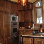 Solid cherry wood cabinets and custom hardware.
