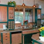 Sink area is flanked by 2 glass door cabinets with 12 small drawers below