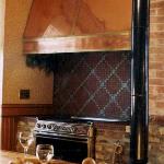 Custom copper hood and tiled backsplash