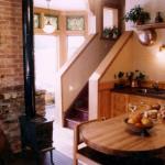 The remodel included opening up  the maid's staircase to the second floor and matching all trim with the old woodwork.