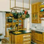Custom oak cabinets, island and copper pot rack and range hood